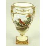 A porcelain urn, circa 1780, possibly Spode, with twin moulded handles,