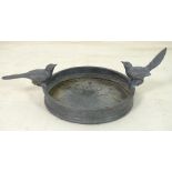 A modern lead circular bird bath, modelled with two birds perching on the upper rim,