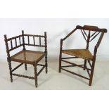 A 19th century oak bobbin turned three legged open armchair, turned arms and back,