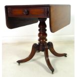 A Regency mahogany sofa table, drop leaves, single drawer opposite false drawer with turned handle,