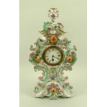 A Dresden china floral mantel clock, decorated in pastel tones with floral relief, gilt highlights,