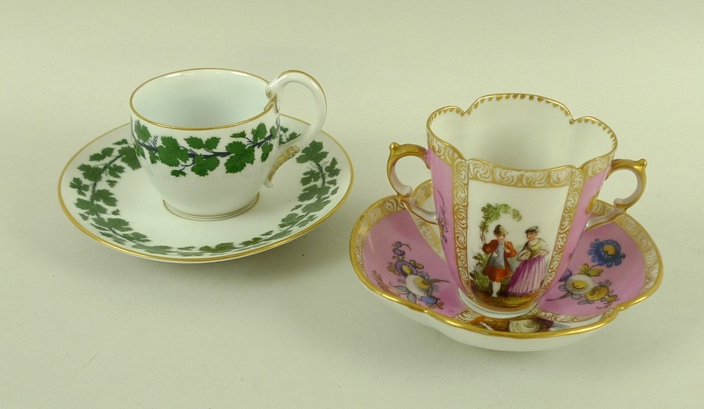 A Dresden porcelain twin handled porcelain tea cup and saucer, 19th century,