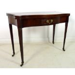 An Edwardian mahogany serpentine fronted and sided card table, kick leg action,