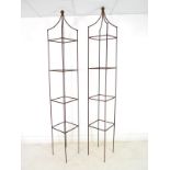 A pair of modern hand forged iron garden obelisks, of tall square section with ball finials,