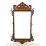 A Georgian mahogany fretwork wall mirror, rectangular plate and gilt slip, 48 by 85cm high.