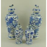 A pair of Chinese porcelain baluster vases and covers, Qing Dynasty, 19th century,