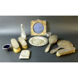 A miscellaneous selection of mostly silver items including a dressing table set with hair brush,