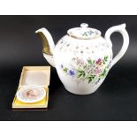 A Russian teapot by Kuznetsov, the porcelain body painted with floral sprigs and gilding, 20cm high,