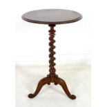 A Victorian mahogany circular occasional table, moulded edge, raised on a barley twist column,