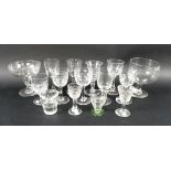 A collection of Georgian and later glasses, including a stirrup cup, wine and port glasses.