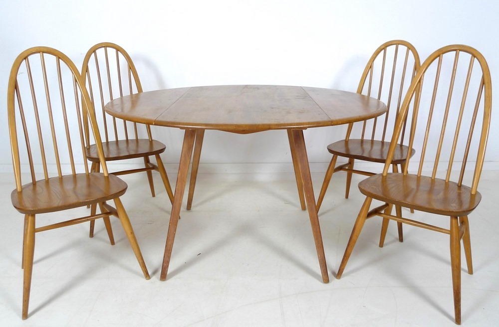 An Ercol dining suite, circa 1960's, comprising circular elm and beech drop leaf dining table, - Image 10 of 10