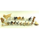 A collection of eighteen Beswick dogs, including dachshund, dalmation, beagle, pug, poodle, spaniel,