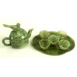 A mid to late 20th century green hardstone miniature tea set, comprising a teapot,