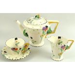 A Burleighware Art Deco china part tea set, decorated in the Fragrance pattern, comprising tea pot,