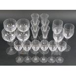 An Orrefors Prelude part set of glasses, all with slice cut facets to lower bowls,