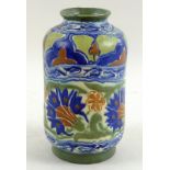 An Art Nouveau cylindrical vase with out turned rim typically decorated with cobalt blue,