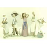 A collection of Lladro figures, comprising a girl in a mauve dress and hat, model no.