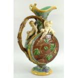 A Mintons majolica moonflask ewer, decorated with three putti and baccanalia, vine form handle,