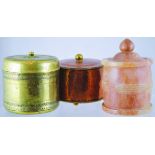 GROUP OF TOBACCO JARS. Brass squat cylindrical jar & cover plus hammered copper cylindrical jar &