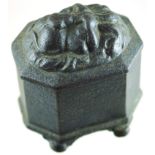 CAST IRON TOBACCO JAR. 4ins tall to top of lions head in relief to lid, octagonal form, c. 1800-