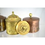 GROUP OF TOBACCO JARS. Two brass, one copper jar, all cylindrical, one with hammered finish &