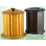 PAIR OF TREEN TOBACCO JARS. Tall mahogany stained jar, zinc lined with weighted lid & satinwood