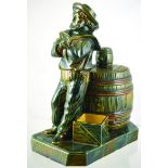 SAILOR TOBACCO JAR. 10ins tall in shiny green & brown glaze. Full standing figure of sailor