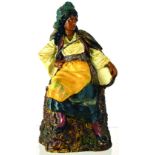 LARGE FIGURAL TOBACCO JAR. 10ins tall, continental terracotta jar formed as a seated moorish lady