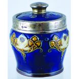 DOULTON TOBACCO JAR. 5.5ins tall to top of lid with silver finial. Art Nouveaux style raised