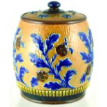 DOULTON TOBACCO JARS. 6.25ins tall to top of lid. Dark blue raised leaves & brown & blue flowers