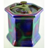 BOURNE DENBY TOBACCO JAR. Six sided shape in most unusual streaky purple glaze with brass clamp lid.