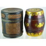 PAIR CHINESE STYLE TOBACCO JARS. Wooden bamboo style with carved panels, lead lined 6.75ins tall.