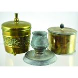 PAIR OF TOBACCO JARS. Brass cylindrical jar with thistle finial, hinged lid on three ball feet, c.