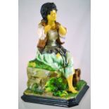 CONTINENTAL MAJOLICA? POTTERY TOBACCO JAR & COVER. In form of a seated lady in green, brown, blue,