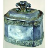 LEAD TOBACCO JAR. 4.25ins tall to top of fleur de lys cover. Canted octagonal form with raised