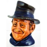 TOP HATTED GENT TOBACCO JAR. 6.25ins tall, Dickens style character, brown, black & flesh coloured
