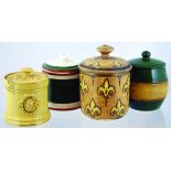 GROUP OF TOBACCO JARS. Matt brown glaze jar & cover with fleur de lis design plus cream glazed jar &