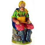 LARGE FIGURAL TOBACCO JAR. 10.5ins tall, continental terracotta jar formed as a seated pirate,