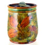 DOULTON TOBACCO JAR. 6.5ins tall, autumn leaves design in brown & green with metal spring twist lid.