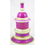 FOUR TIERED TOBACCO JAR. 15ins tall, in pink, white & gold. Top formed as a candlestick, below a