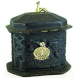 LEATHER TOBACCO JAR. 6.5ins tall to top of silver plated greyhound finial, casket shape with tamper,