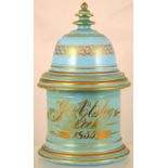 LEEK CHINA TOBACCO JAR. 10ins tall to top of lid. Pale blue glaze with gold decoration J. ASTLEY/