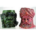 PAIR OF TOBACCO JARS. One large green glazed head of angry looking man smoking pipe, c. 1900 (no