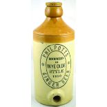 LARGE BULK GINGER BEER BOTTLE. 16.5ins tall, to top of stopper, tan top, lower off white glaze,