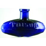 SUBMARINE POISON BOTTLE. (DP pg 25) 2.5ins tall, 4ins long, cobalt blue glass. Embossed POISON to