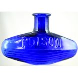 SUBMARINE POISON BOTTLE. (DP pg 25) 3.25ins tall, 5ins long, cobalt blue glass, embossed POISON to