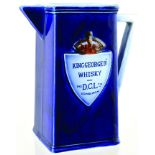 EDINBURGH D.C.L. WHISKY JUG. 6.25ins tall, strong cobalt blue glaze, variating colour on handle &