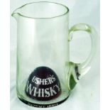 USHERS WHISKY JUG. 7.5ins tall, clear glass, handled jug with raised ruby red base, USHERS/ WHISKY