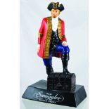 OLD SUGGLER SCOTCH WHSKY ADVERTISING FIGURE. 11.25ins tall, rubberoid figure of ships captain in