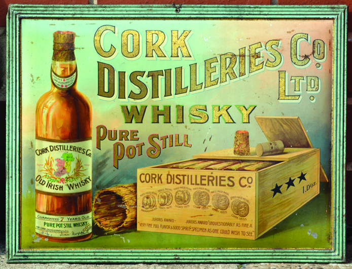 CORK DISTILLERS TIN SIGN. 16.5 x 11.5ins tall, pressed tin sign, pictorial images bottle of whisky &